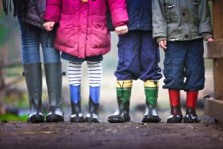 four children standing on dirt during daytime by Ben Wicks courtesy of Unsplash.